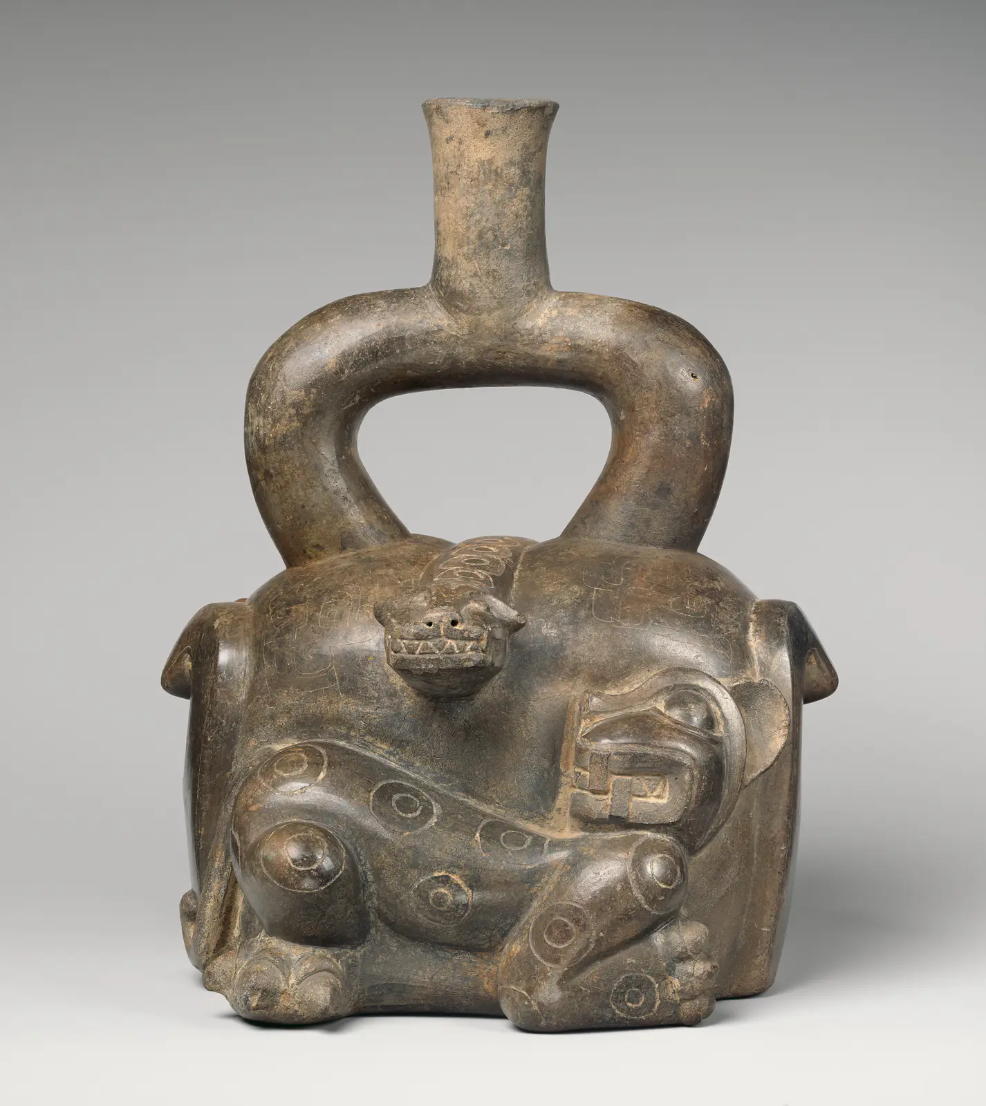 Stirrup-spout bottle with feline and snake