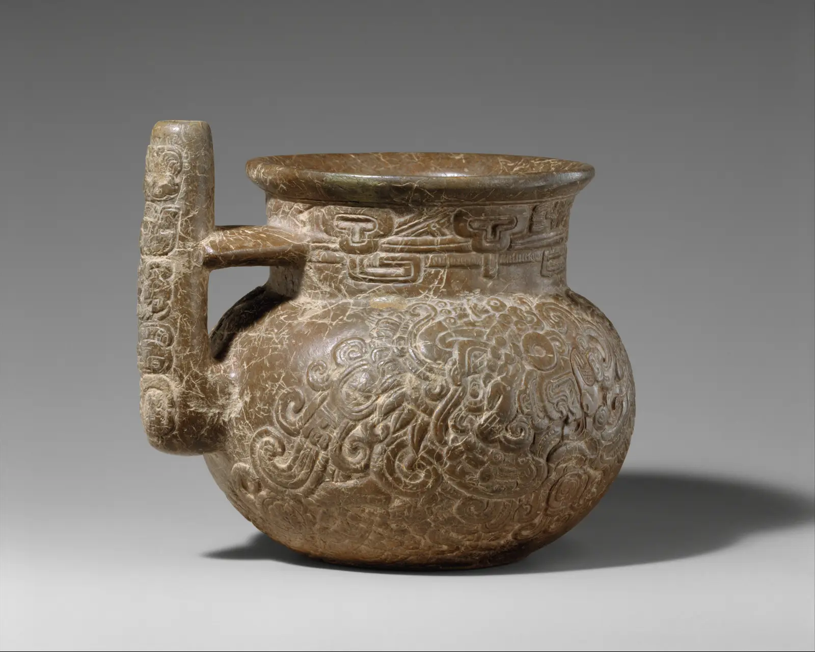 Engraved spouted jar